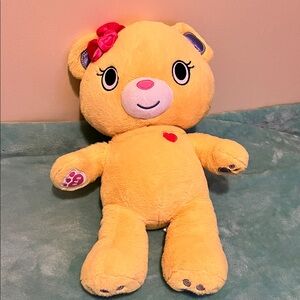 Adorable Yellow Plush Bear with Red Bow